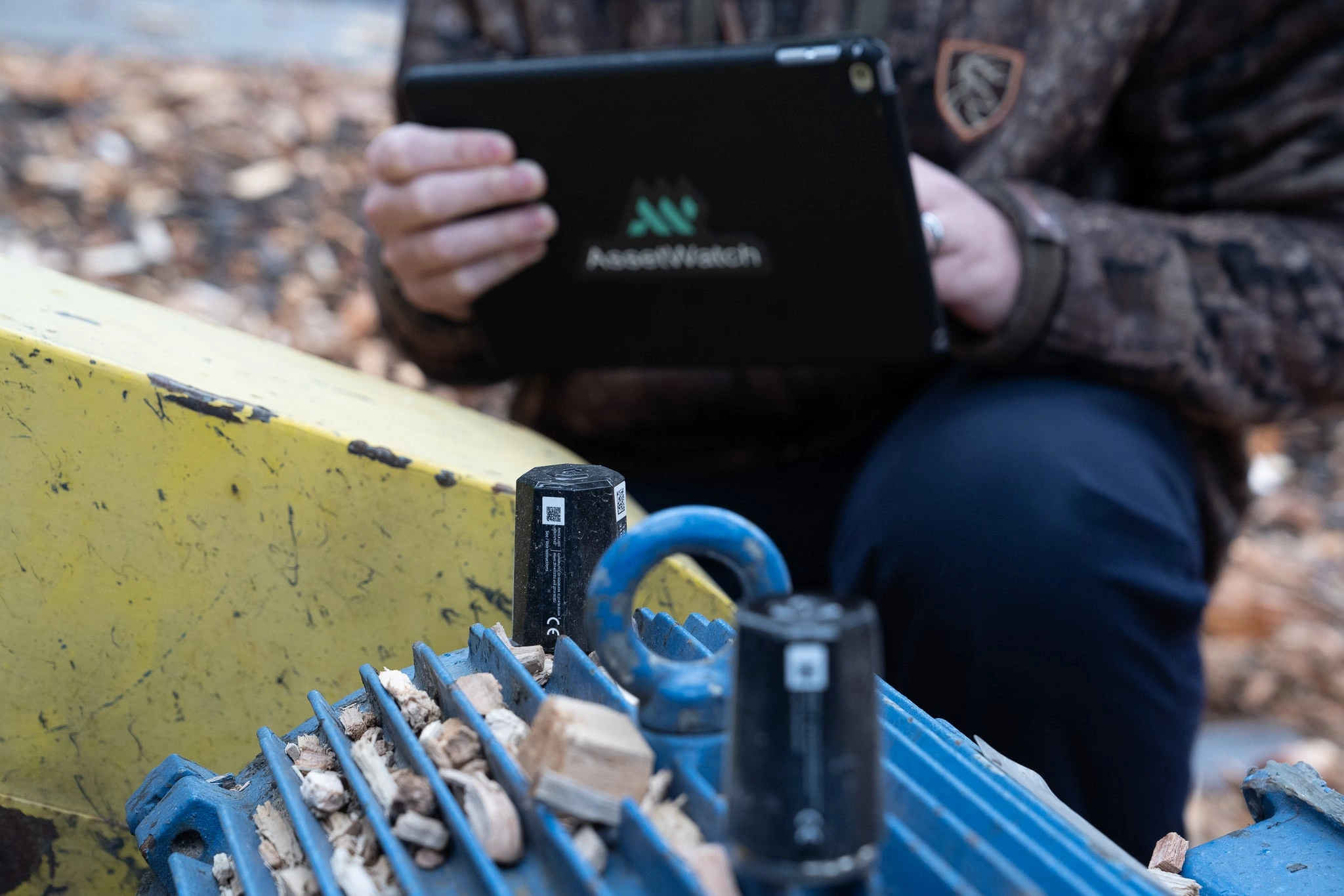 AssetWatch engineer taking sensor reading on a tablet