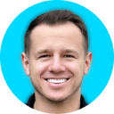 Smiling man on a bright cyan background