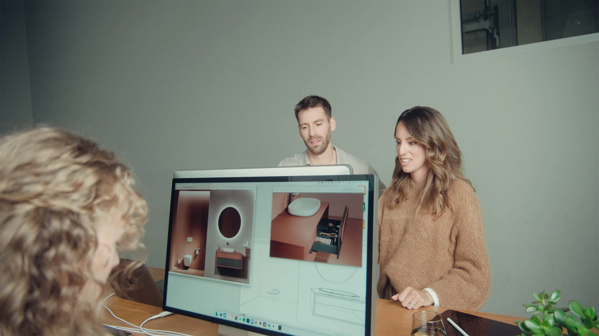 Danthree team discusses a 3D bathroom scene with customer - insight into the collaborative storytelling process.