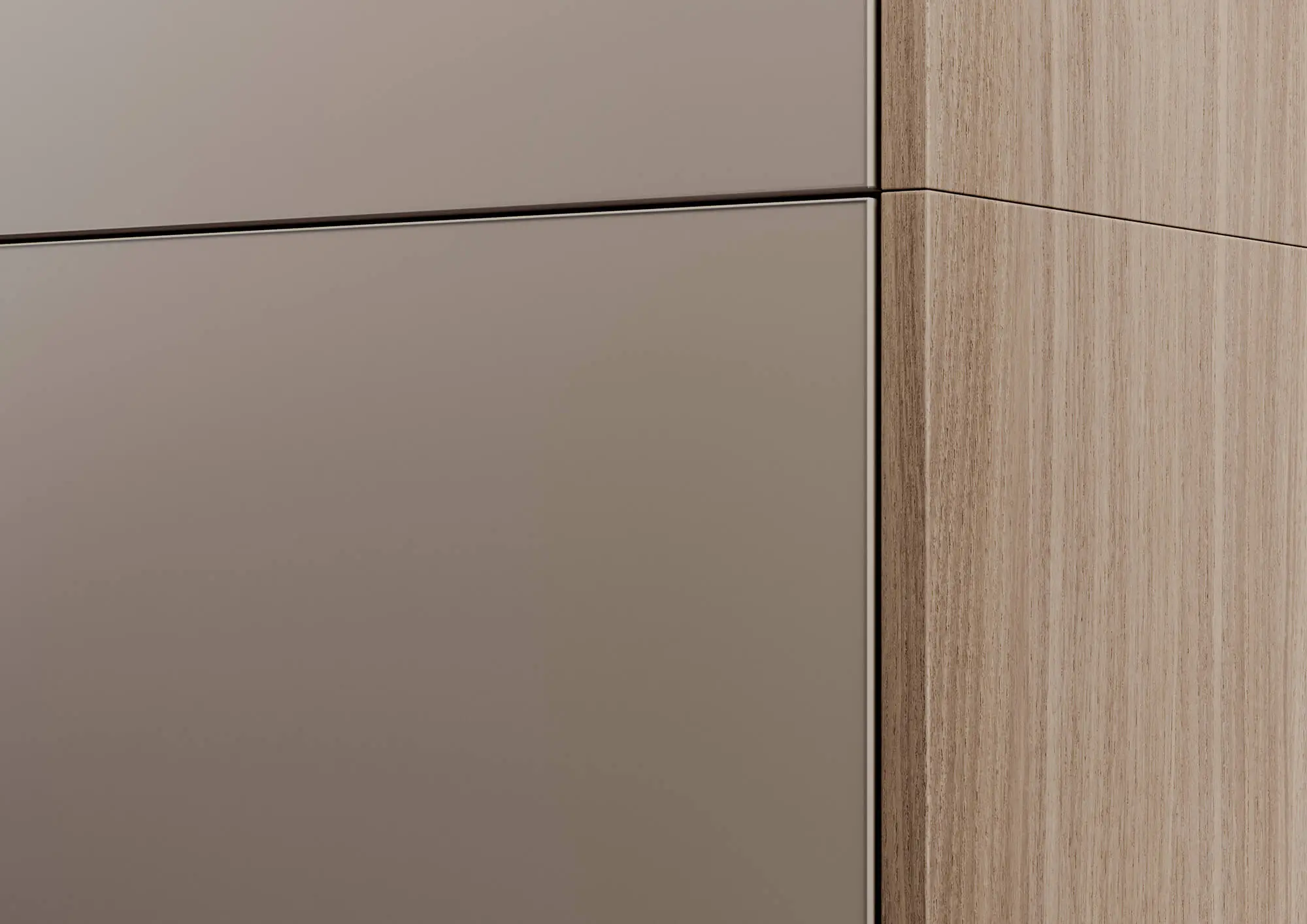 Dettaglio dell'angolo con passaggio dal lato in legno al fronte grigio mandorla; giunzione finemente posizionata e riflessi pacati in una resa della cucina fedele al materiale.