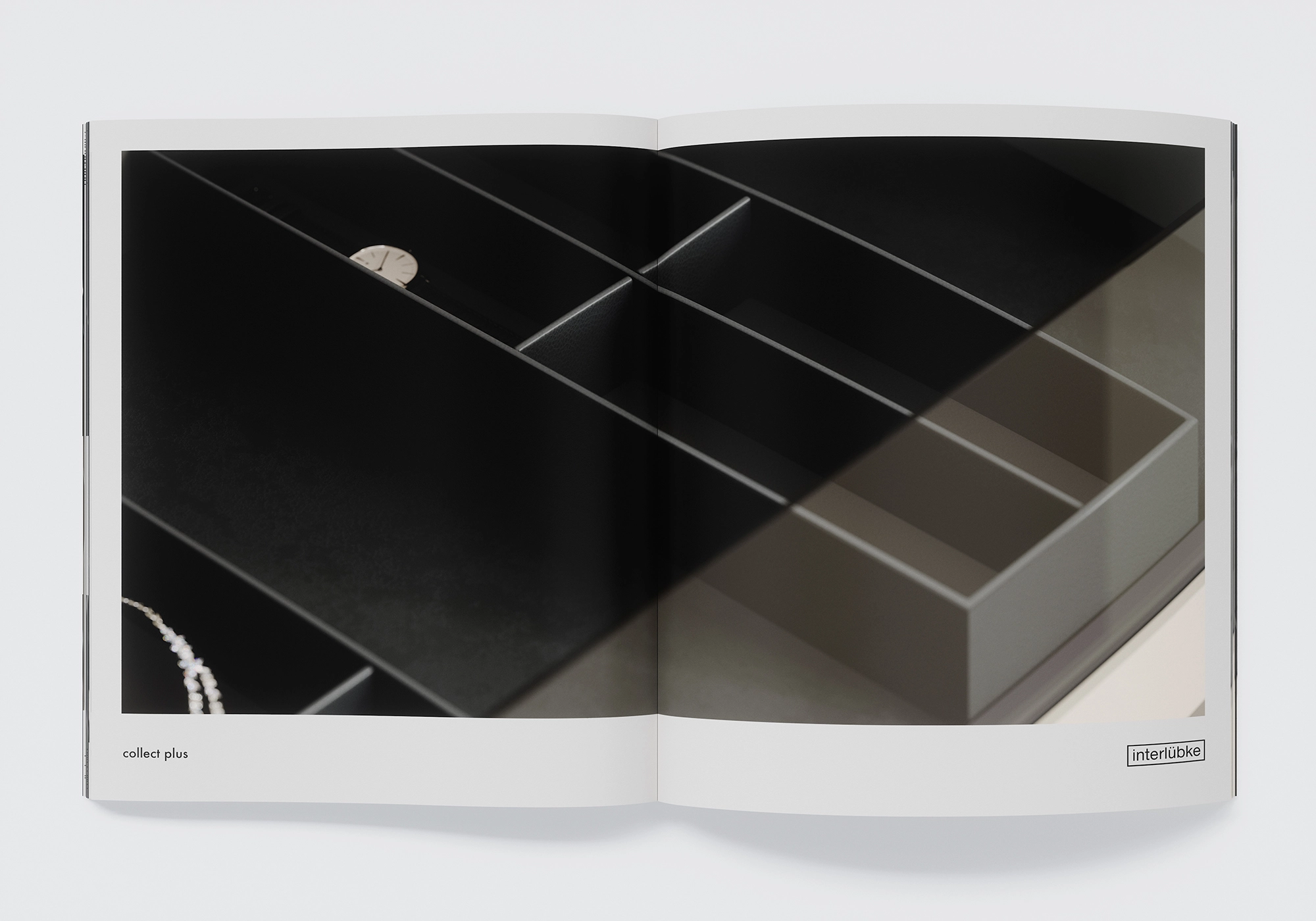 Detaljbild av interlübke collect plus lådförvaring i svart med klockfack - makrorepresentation med realistiska PBR-ytor.