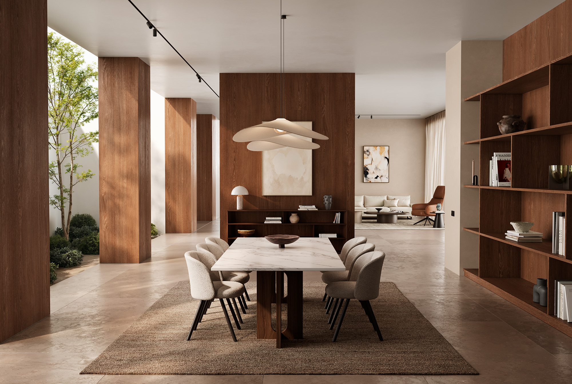 Dining area with a long table, light-colored upholstered chairs, and warm wood surfaces