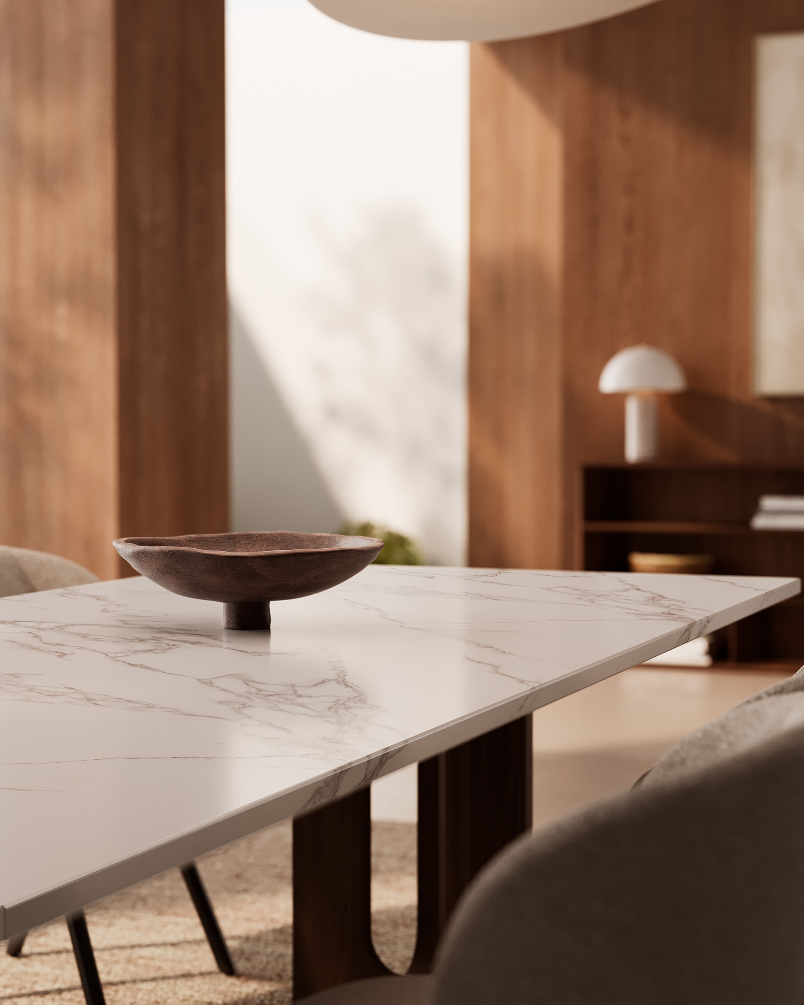 Side lighting on a veined tabletop with a dark bowl