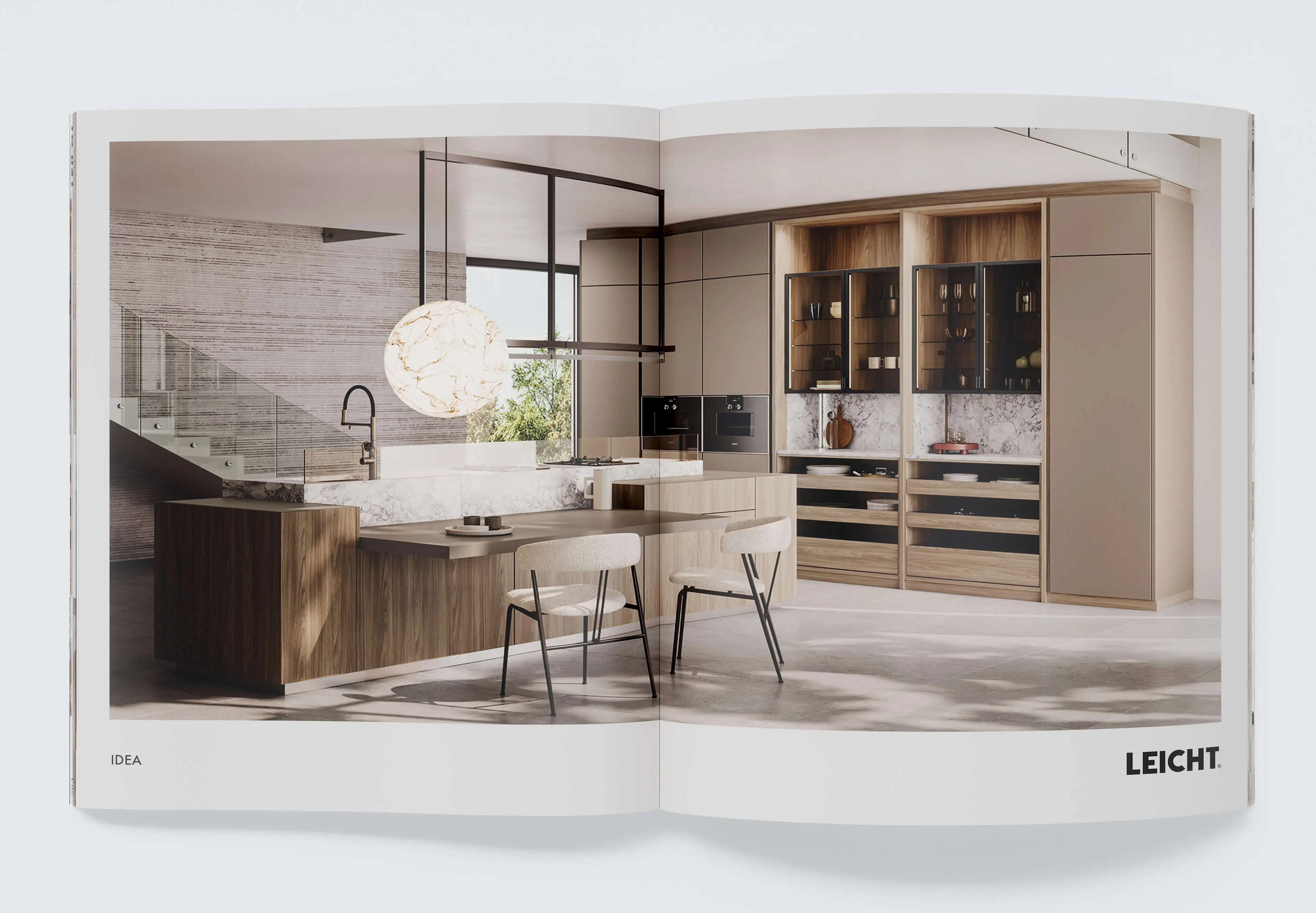 High-end print visualization for kitchen manufacturers: Double-page catalog layout of a luxury kitchen from the Leicht brand with marble island and wood fronts.