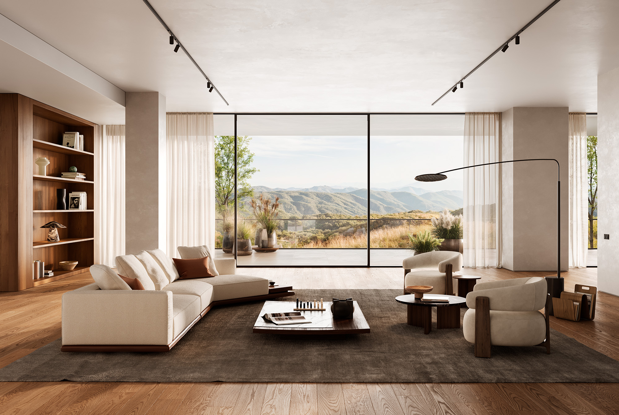 Living area with light-colored upholstered furniture, low tables, and natural light coming in from the side