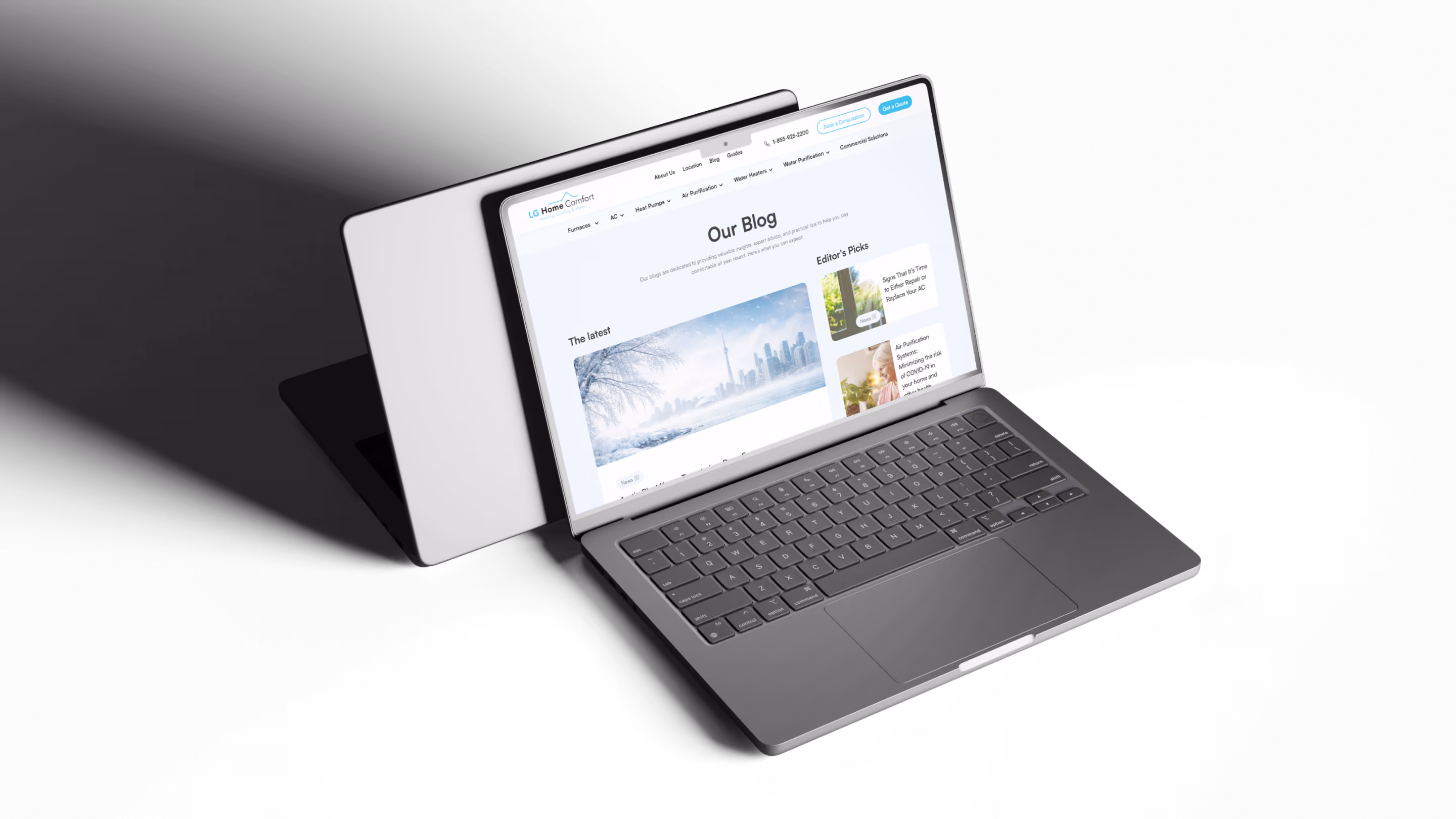 Open laptop showing a webpage titled 'Our Blog' with articles about home comfort and air systems.