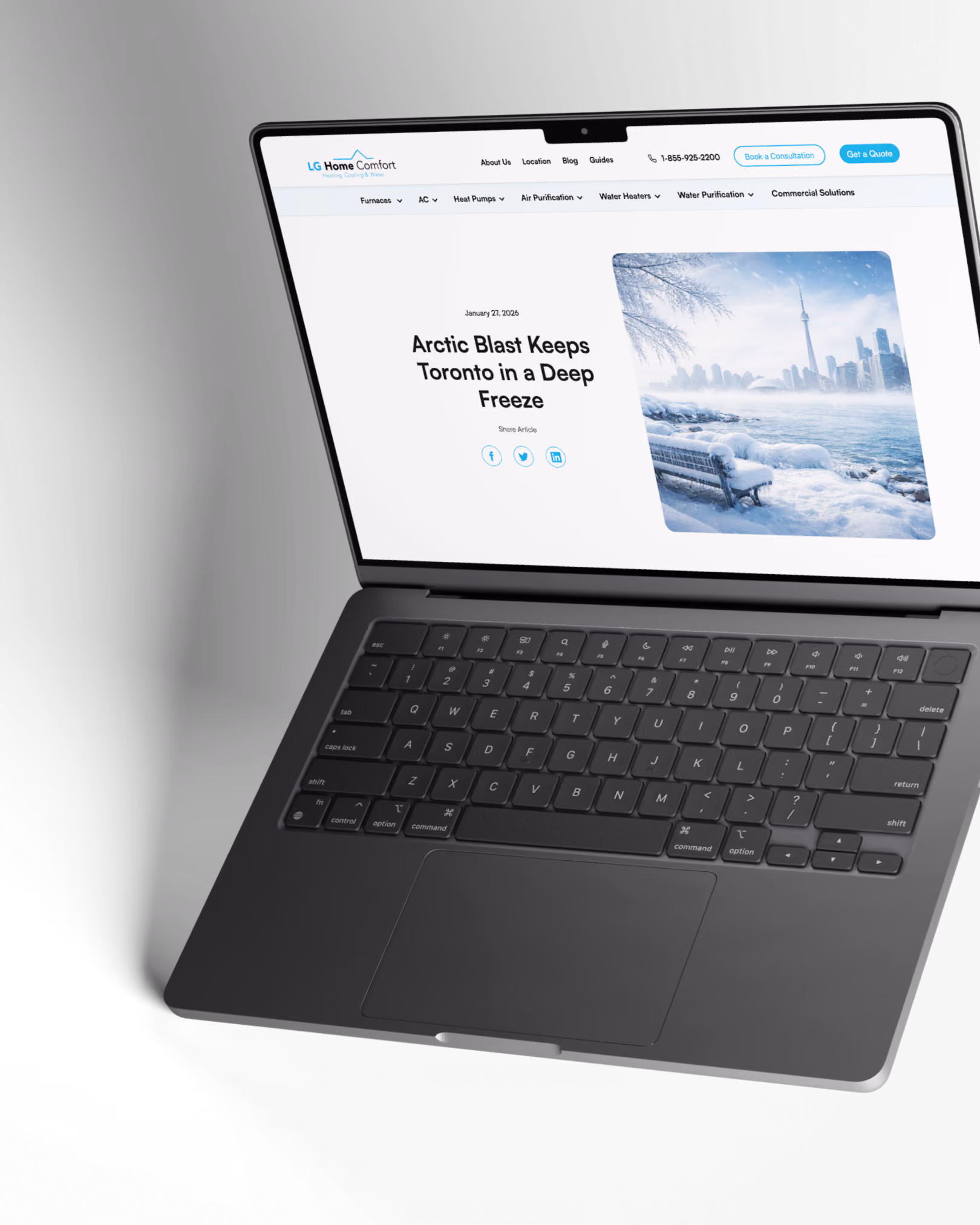 Laptop showing a webpage titled 'Arctic Blast Keeps Toronto in a Deep Freeze' with a snowy cityscape image.