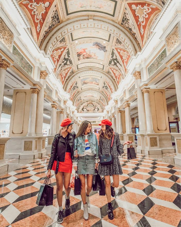 Venetian-style indoor mall with painted sky ceiling and a canal running through the shops.