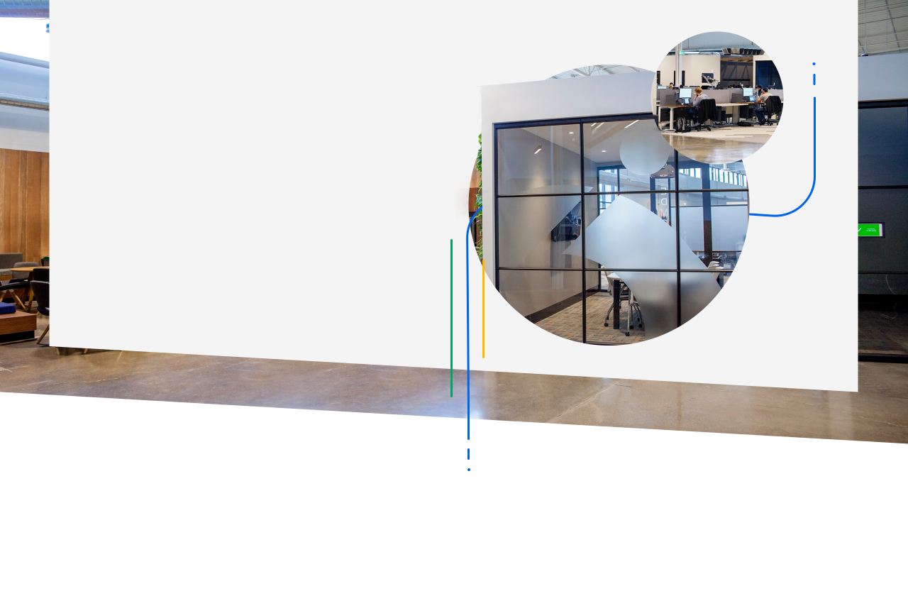Modern Miovision office workspace with glass-walled meeting room.