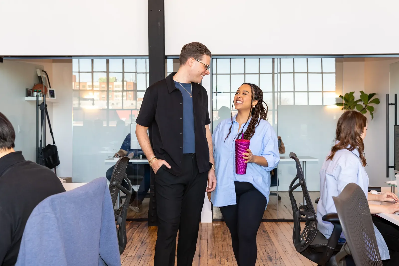 The Influence Agency team members working together in the Toronto studio