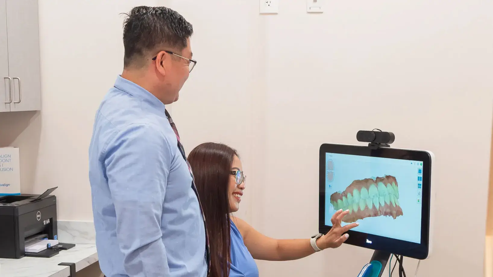 Dr Yang and Mayflower Dental Care team member checking a 3D Imaging