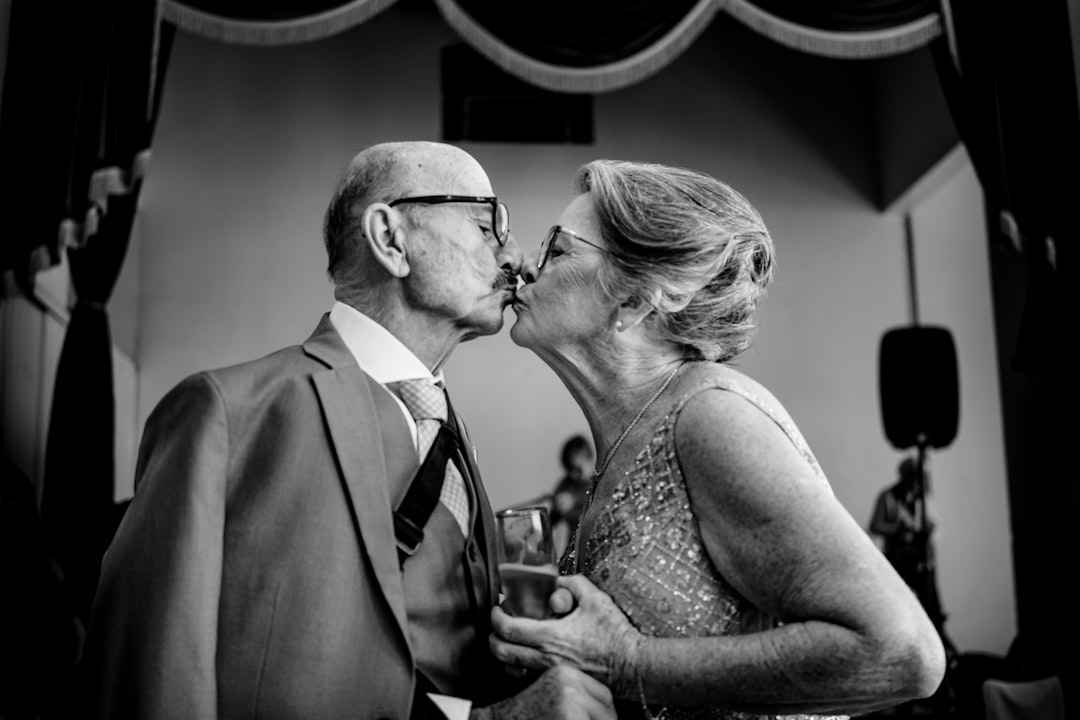 a man and a woman kissing each other