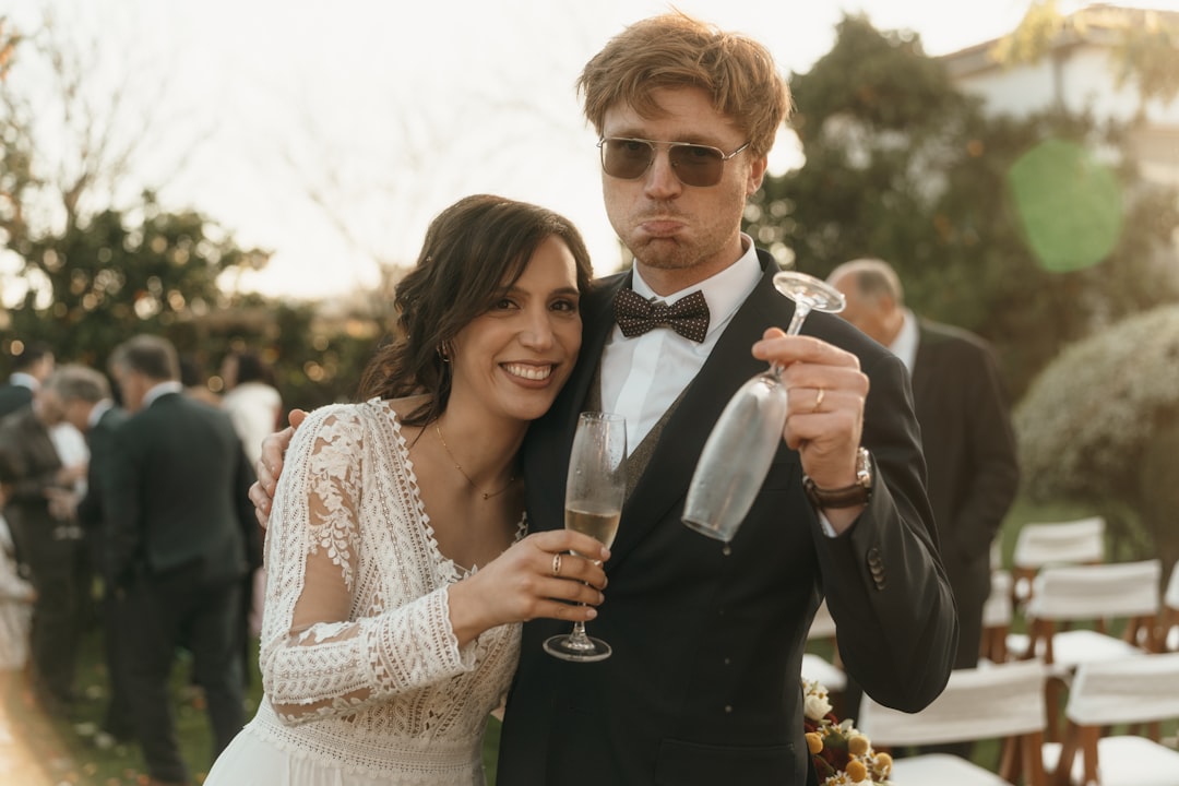 Bride and groom with champagne glasses at wedding
