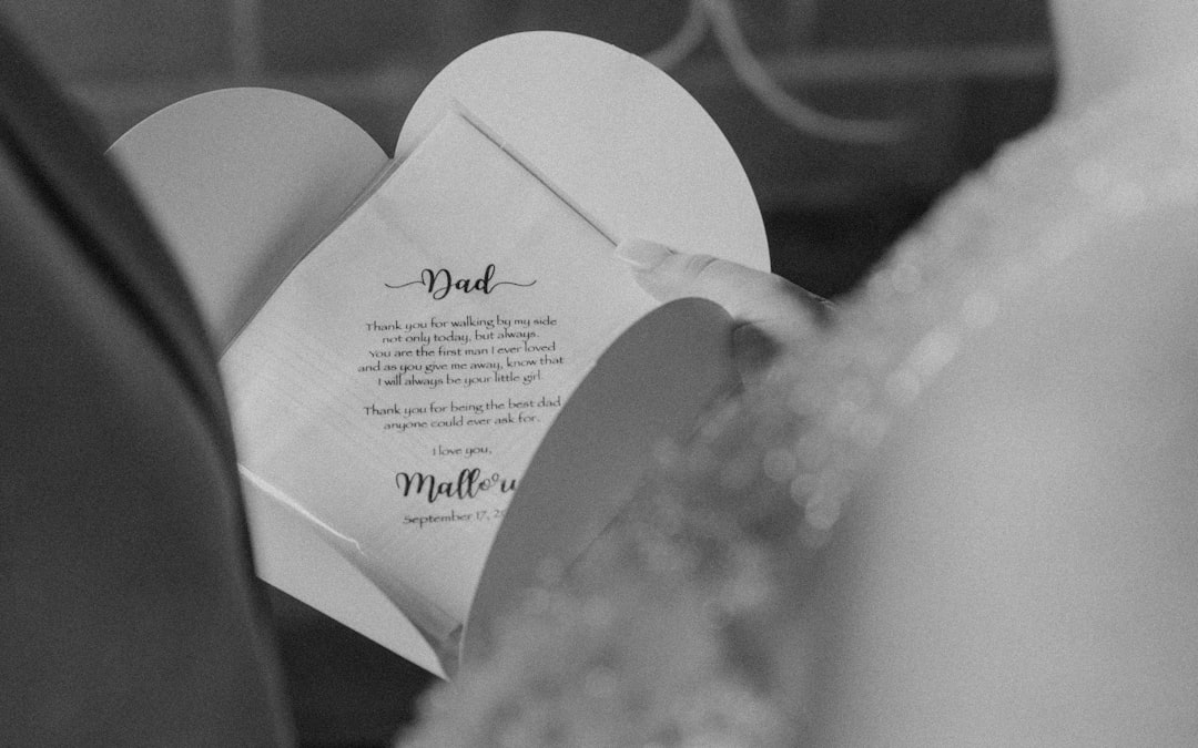 a close up of a person holding a piece of paper