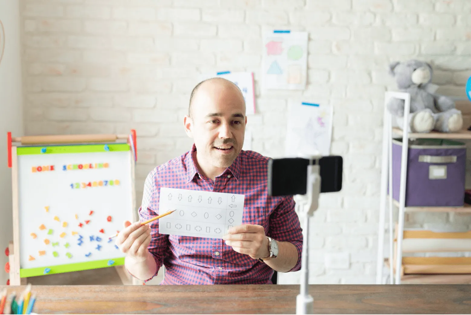 Man teaching online using his phone