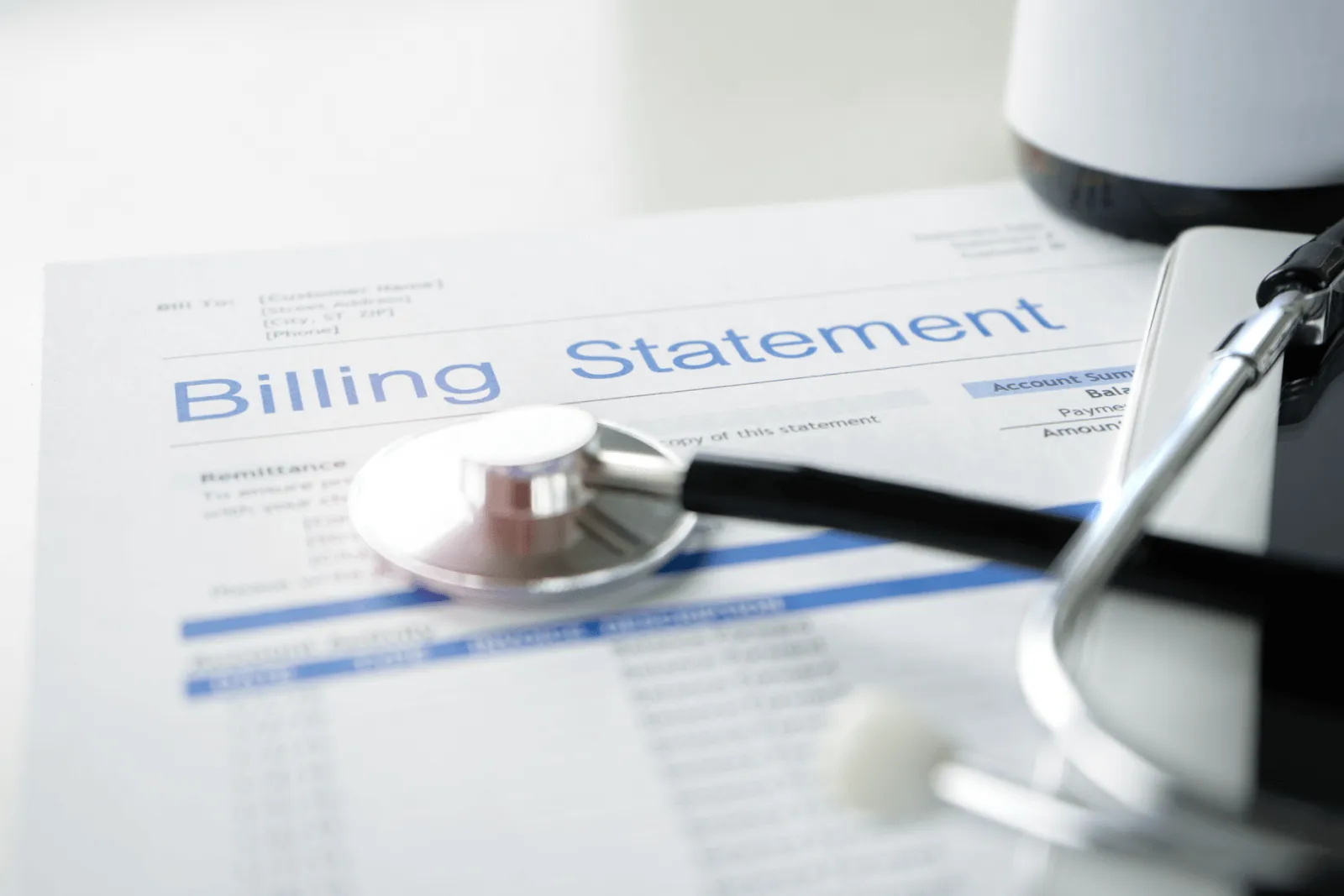 Stethoscope on a billing statement