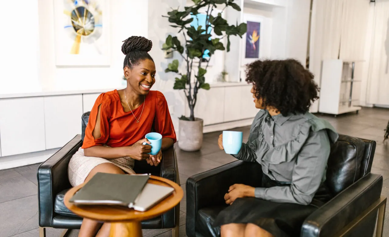 Two women talking in an office