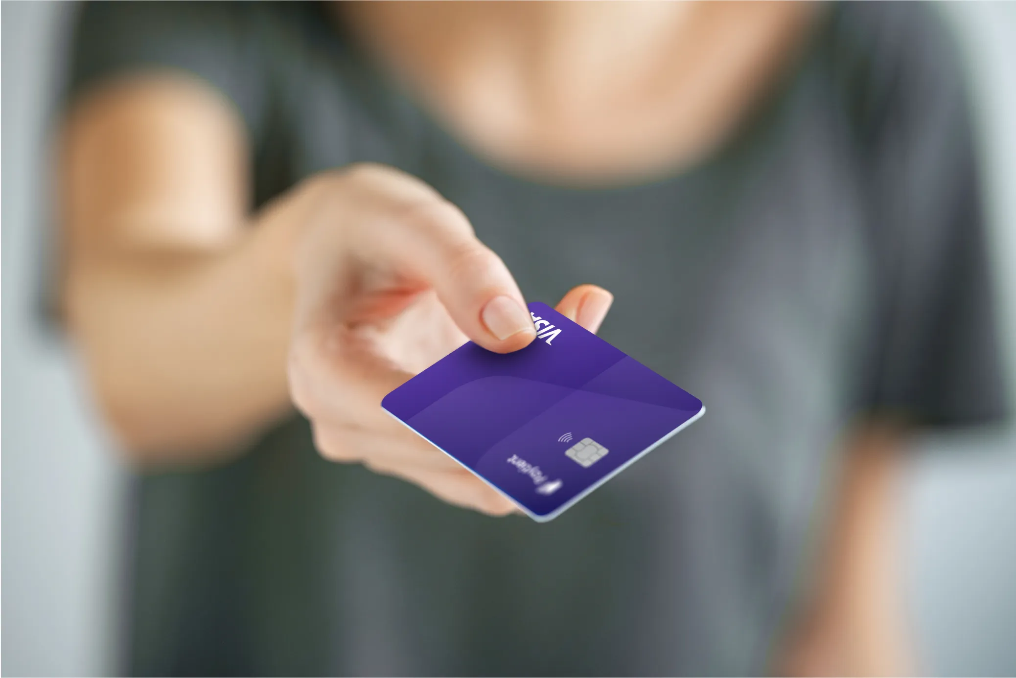 Close-up of a hand holding a purple Paytient health payment card, offering a seamless solution for managing healthcare expenses.