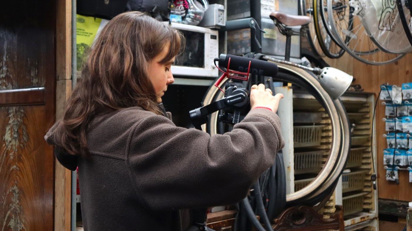Digital marketer filming content on a camera.