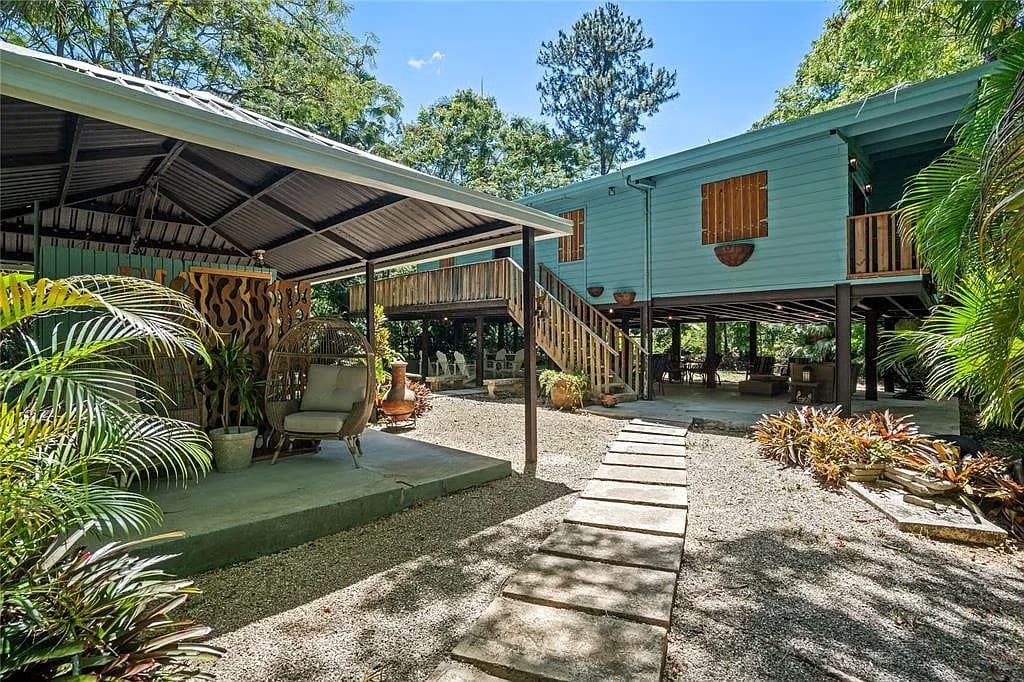 Raised green house and covered carport at Guavate 184 Bo in Cayey, Puerto Rico
