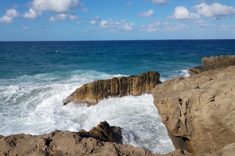 Waves breaking along the rocky shoreline in Isabela, Puerto Rico