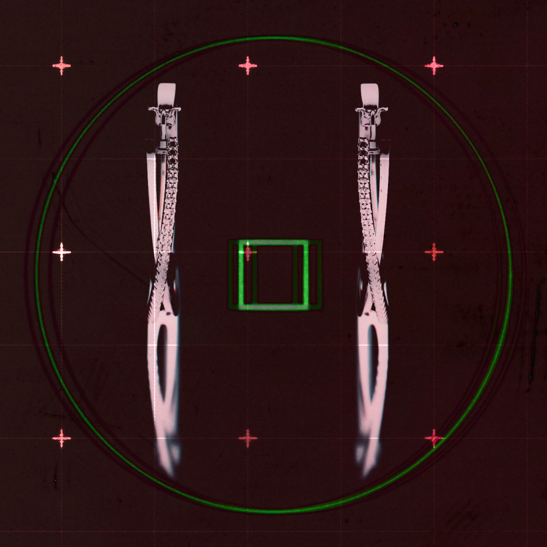 Top-down X-ray view of two knives placed parallel inside a circular frame with crosshair markers around.