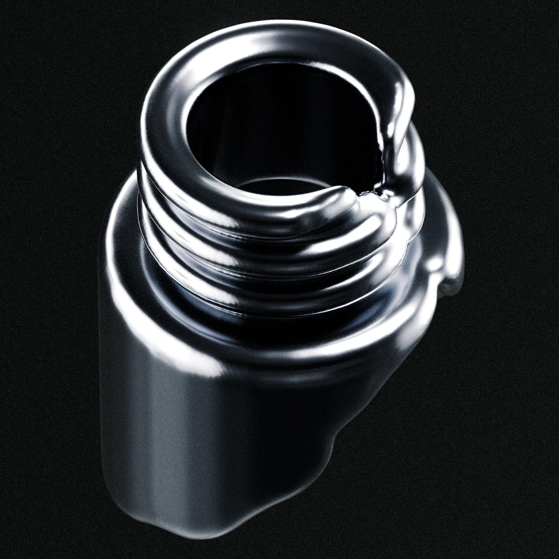 Close-up of a shiny black metallic gear with smooth, reflective surfaces and curved teeth.