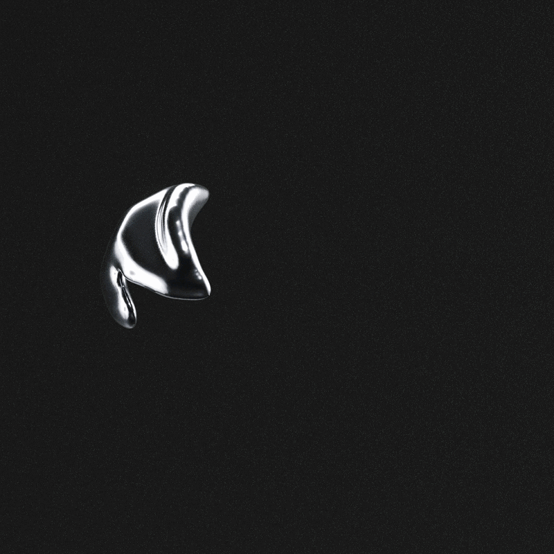 Close-up of a shiny black metallic gear with smooth, reflective surfaces and curved teeth.