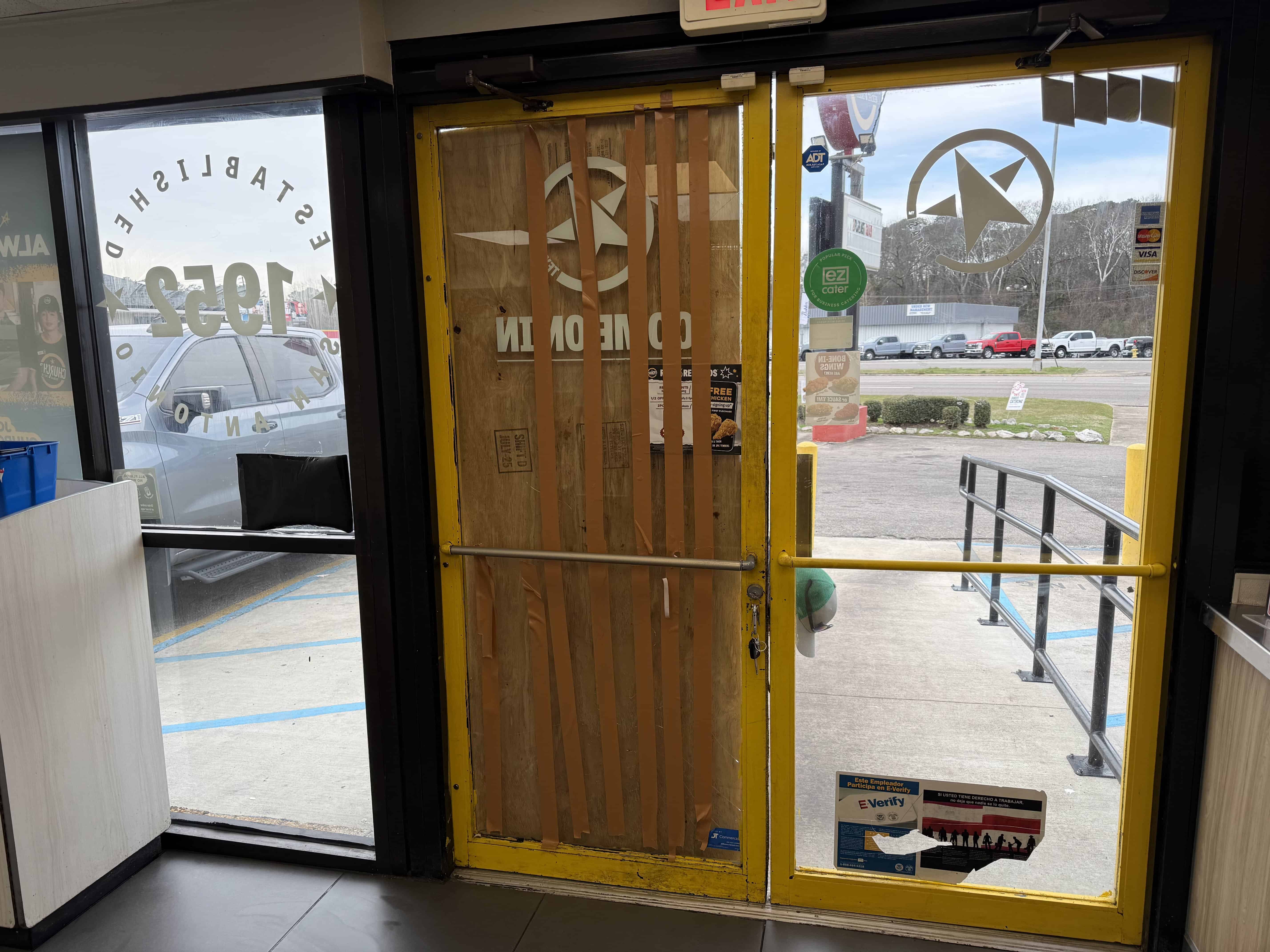 Churches Chicken boarded up store front.
