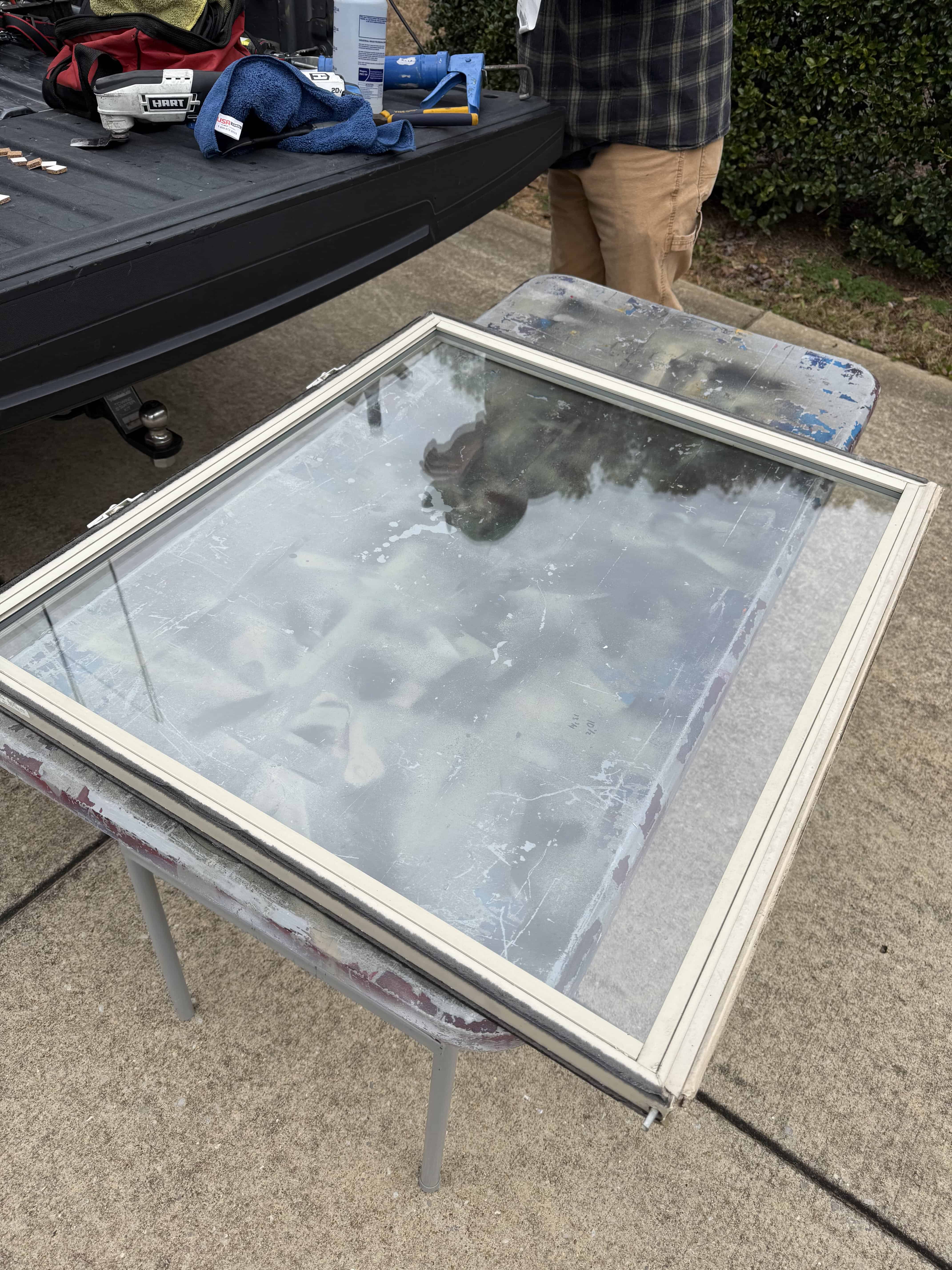 Store front glass being repaired