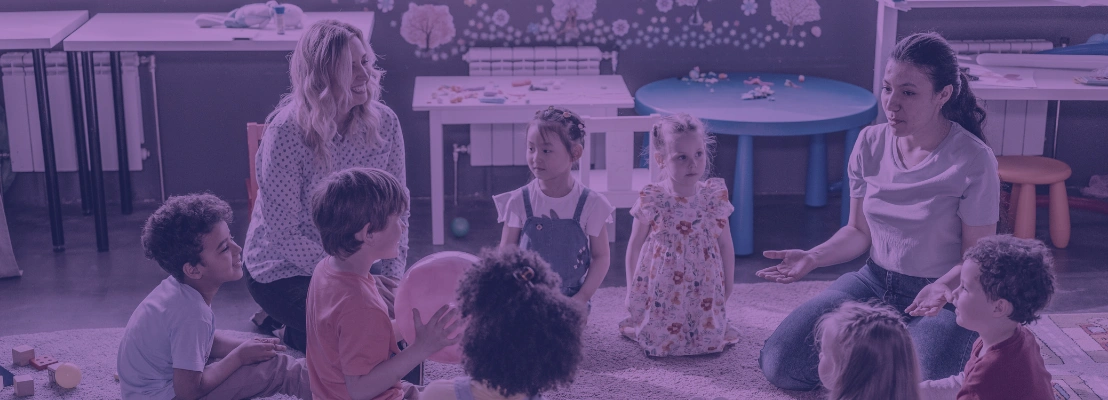 Children and daycare workers sitting in a circle
