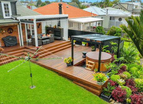Backyard design and build with hot tub, pergola, decking, fencing, and landscaping