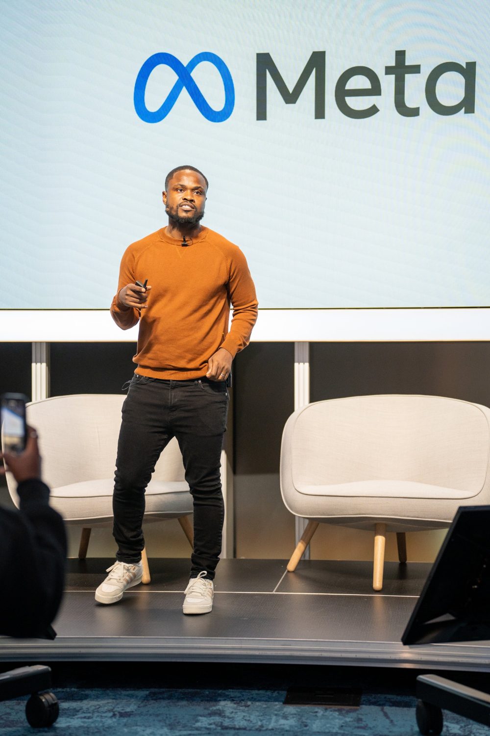 Masibu Manima speaking on stage at Meta HQ in 2023