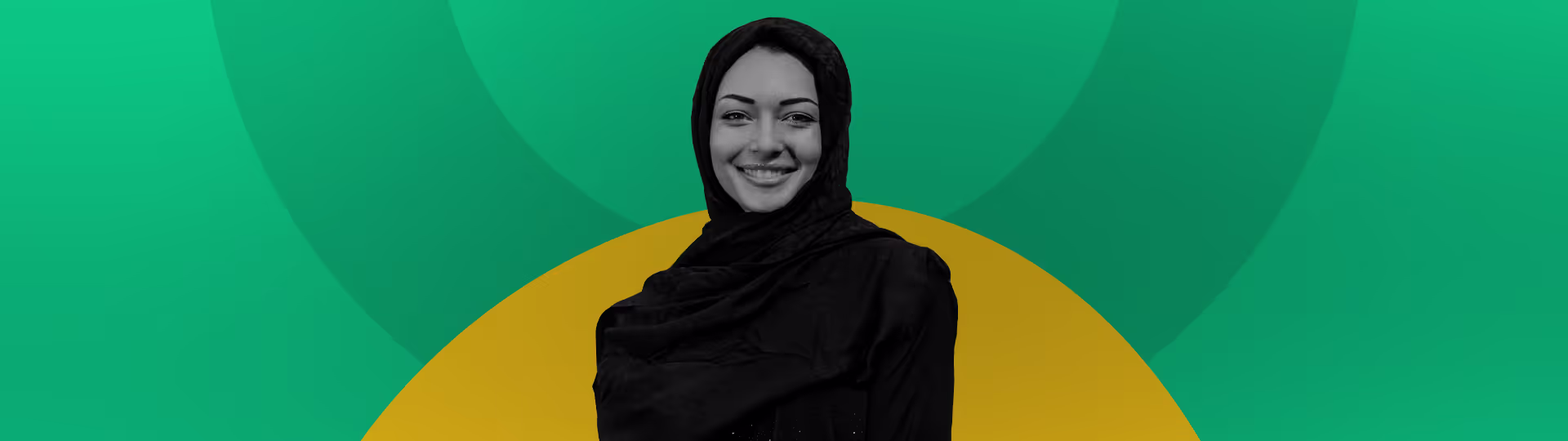 A woman in a black outfit with a green background.