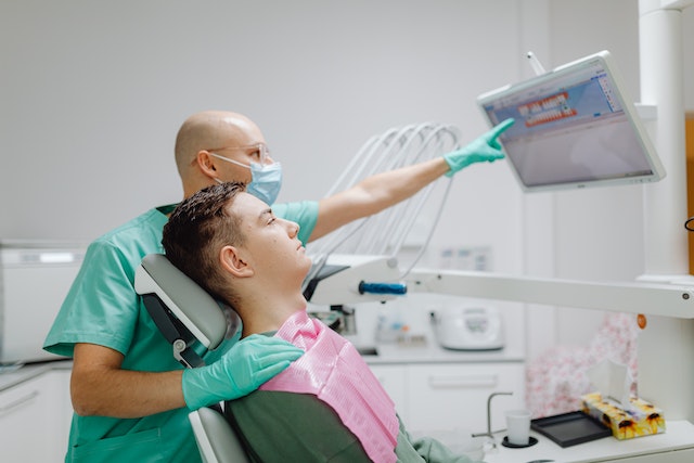 Patient resting comfortably during recovery from a tooth extraction