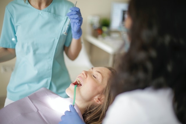 Dentist reviewing a patient's newly placed dental crown