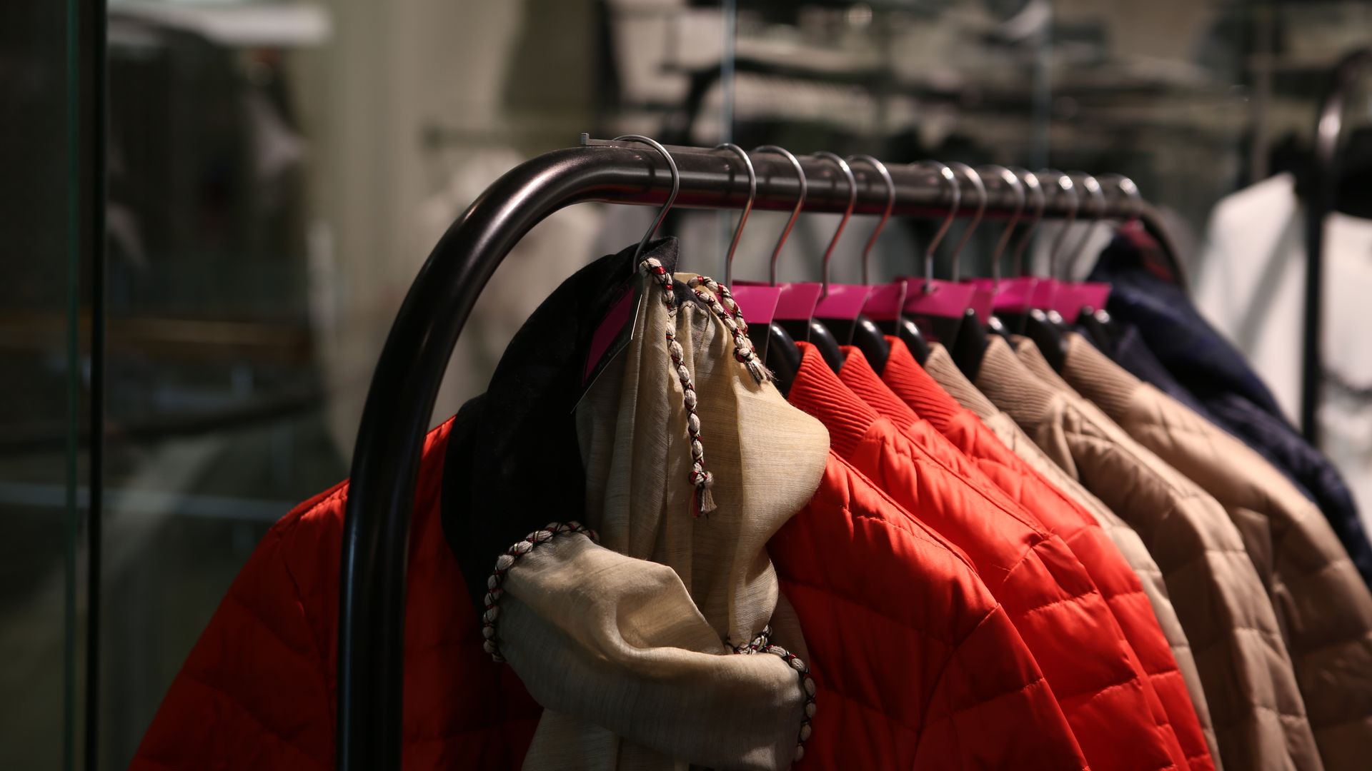 Colorful jackets and clothing on hangers in a store, representing apparel fulfillment
