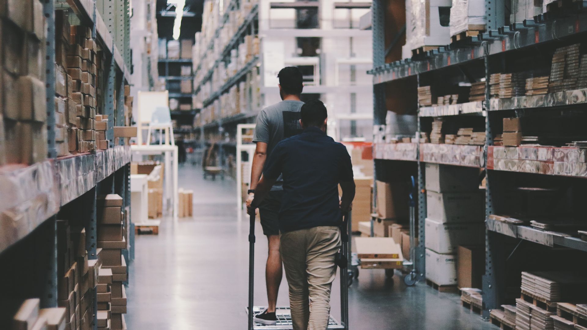 Interior of a modern fulfillment warehouse with tall storage racks
