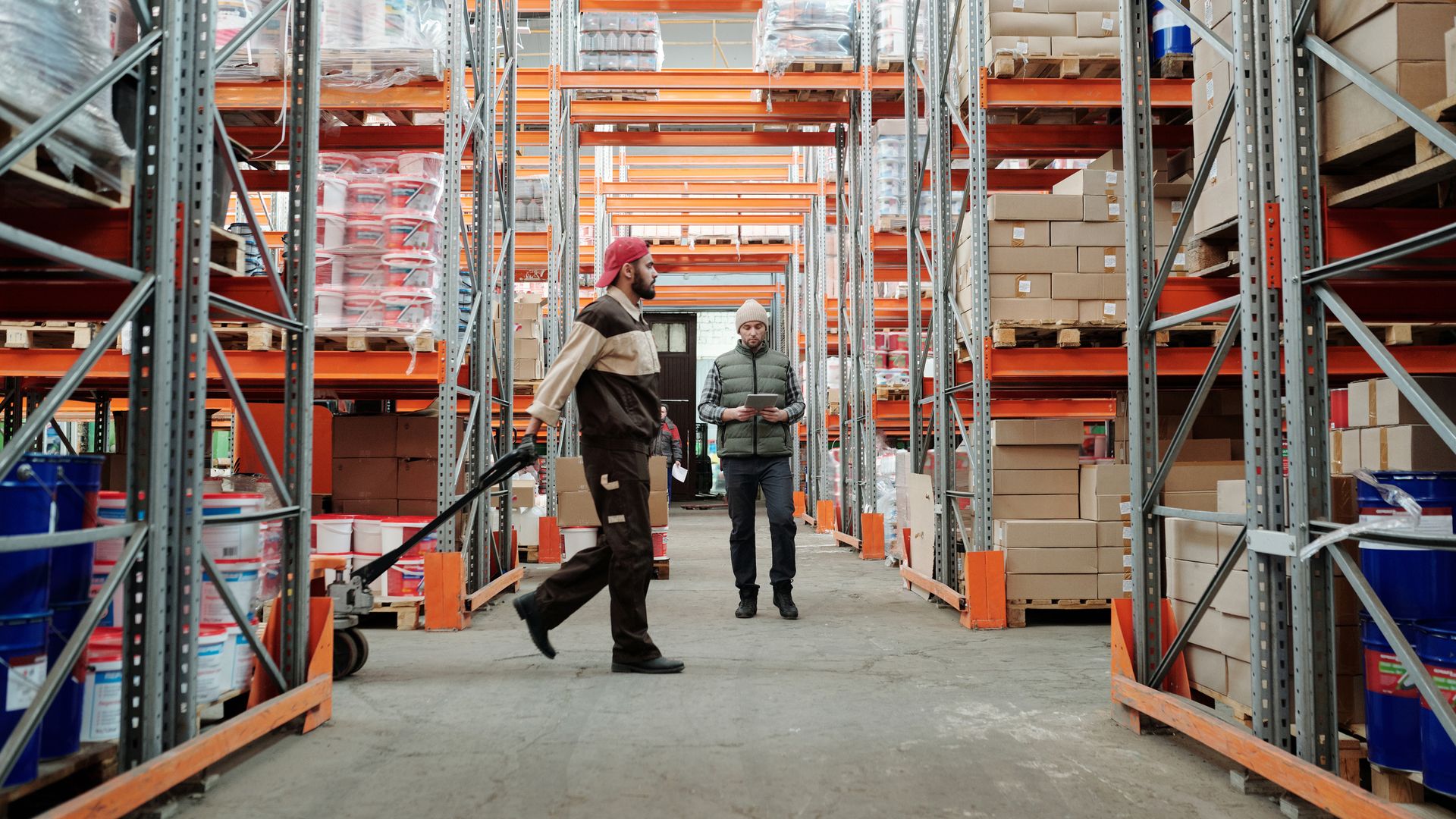 Warehouse team reviewing inventory levels on shelves ahead of Q4 peak demand