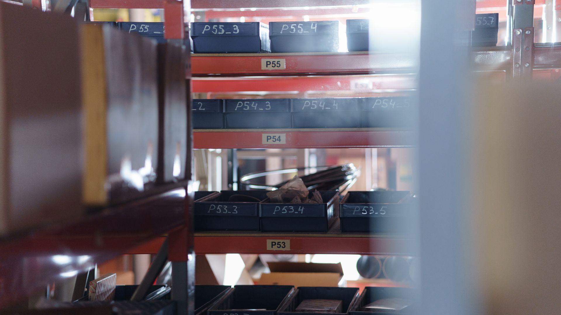 Labeled shelves holding buffer inventory in an ecommerce warehouse