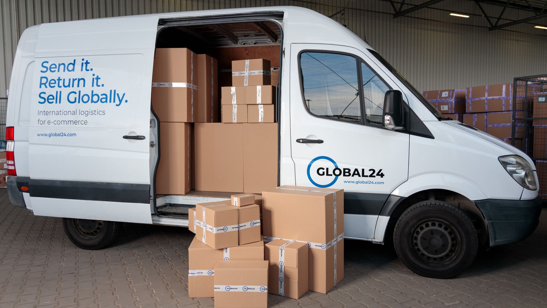 Cardboard boxes loaded in a delivery truck at a warehouse dock