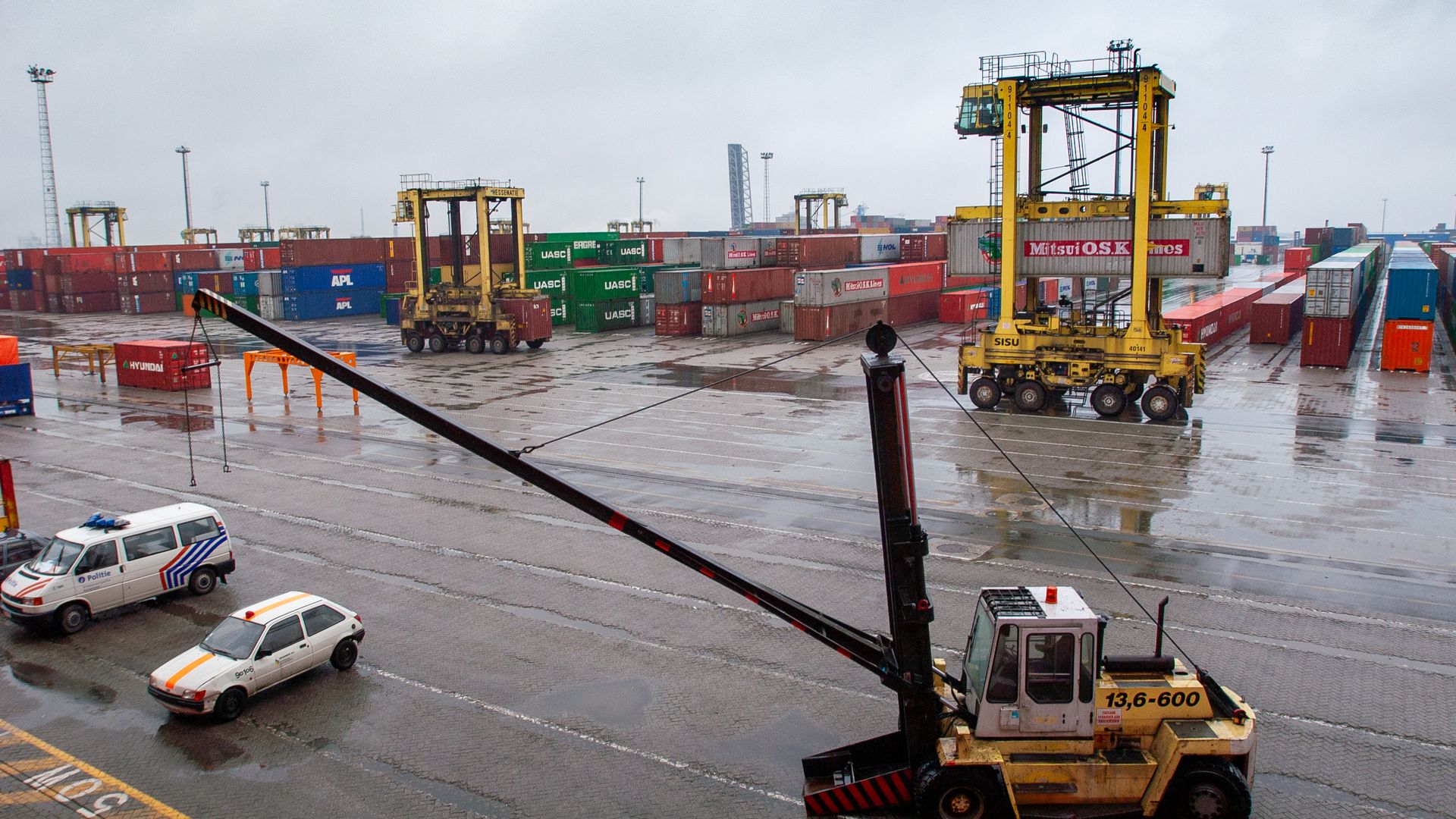 Container terminal with straddle carriers and stacked shipping containers