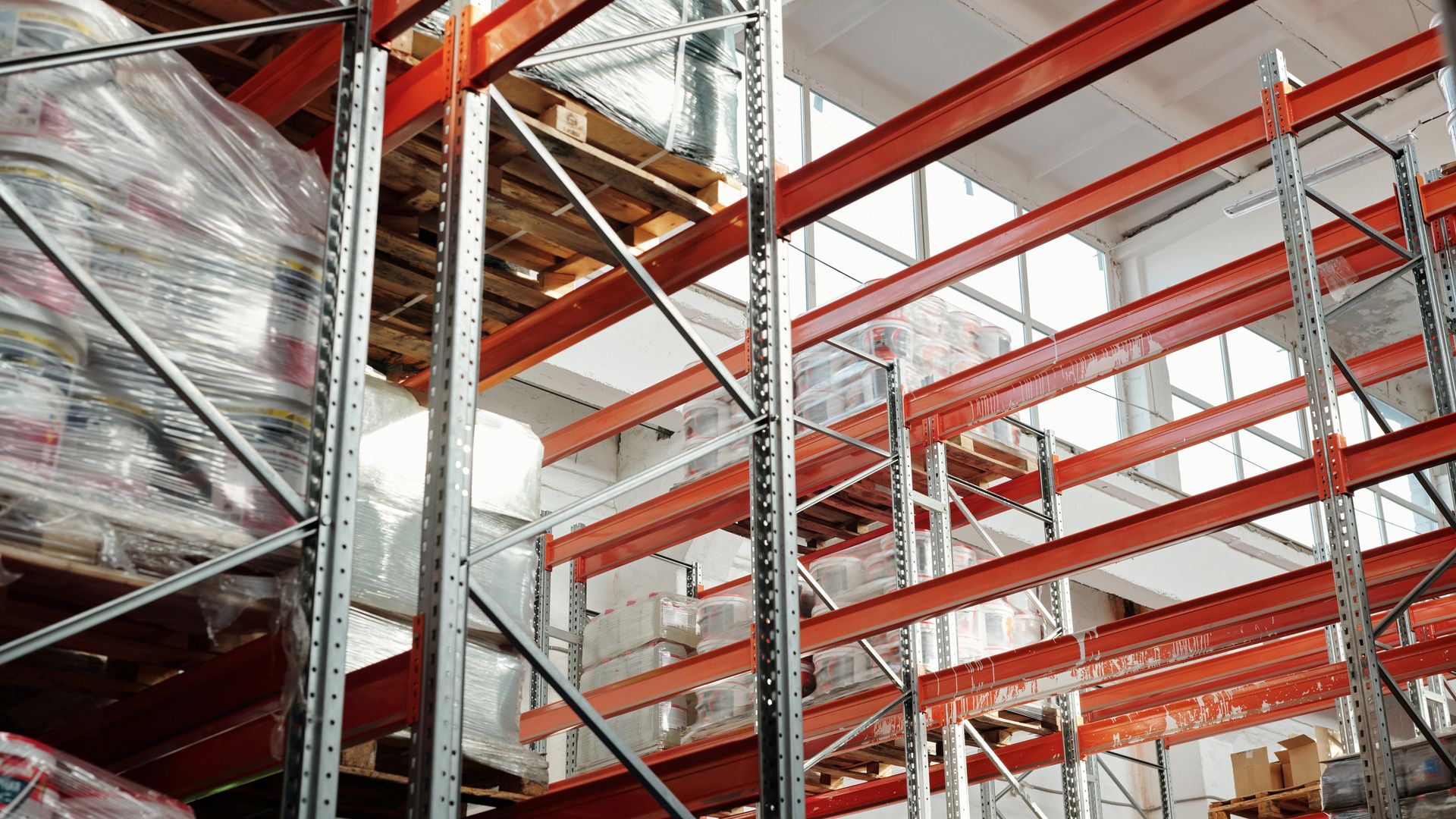 Bright modern warehouse with pallets and storage racks used for food-grade storage and fulfillment