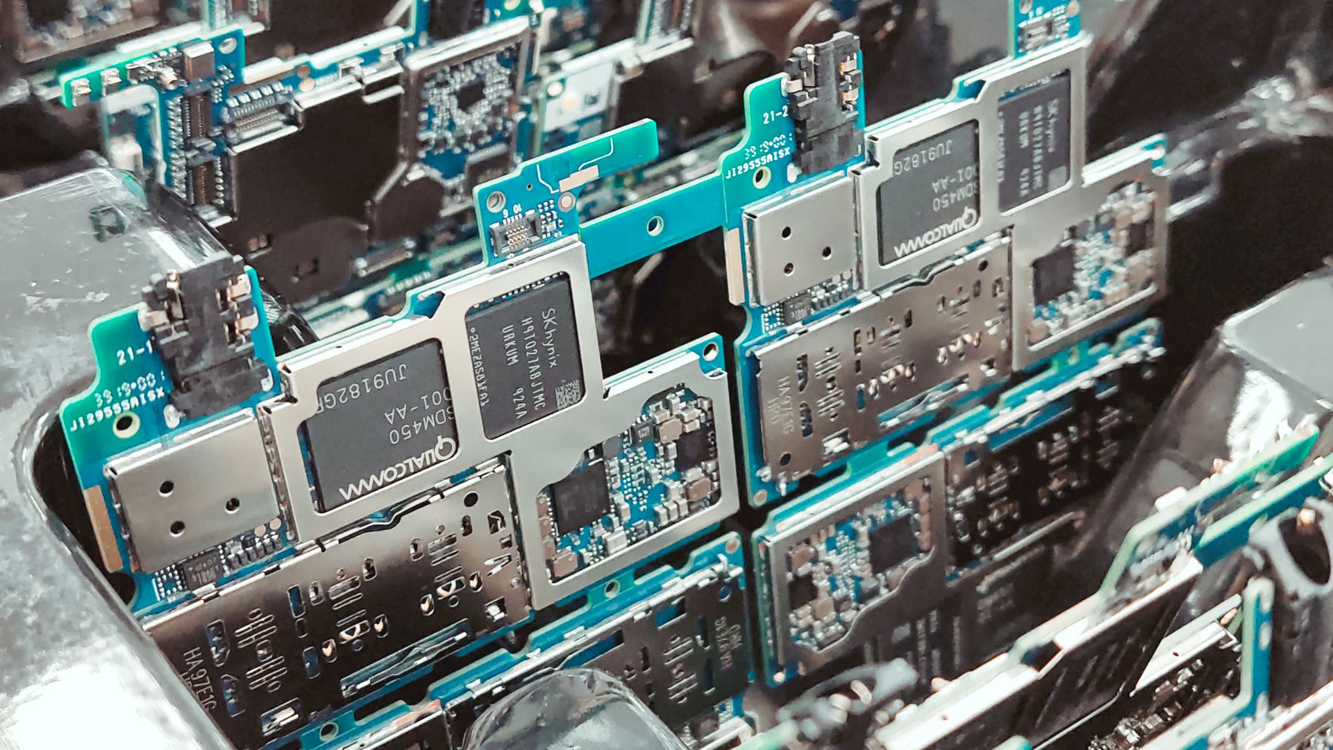 Close-up of electronic circuit boards in a factory, representing consumer electronics fulfillment