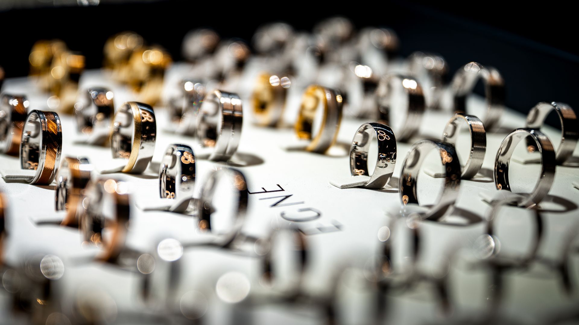 Elegant display of luxury gold and gemstone rings in a retail jewelry case