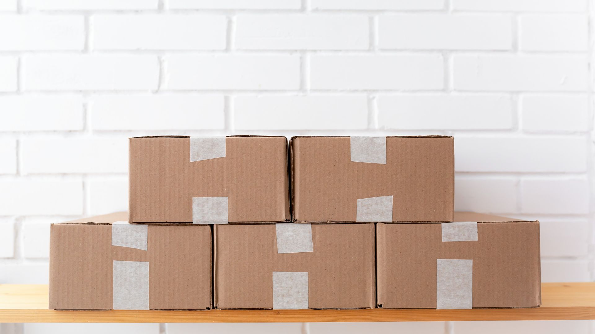 Stacked brown cardboard shipping boxes ready for outbound fulfillment