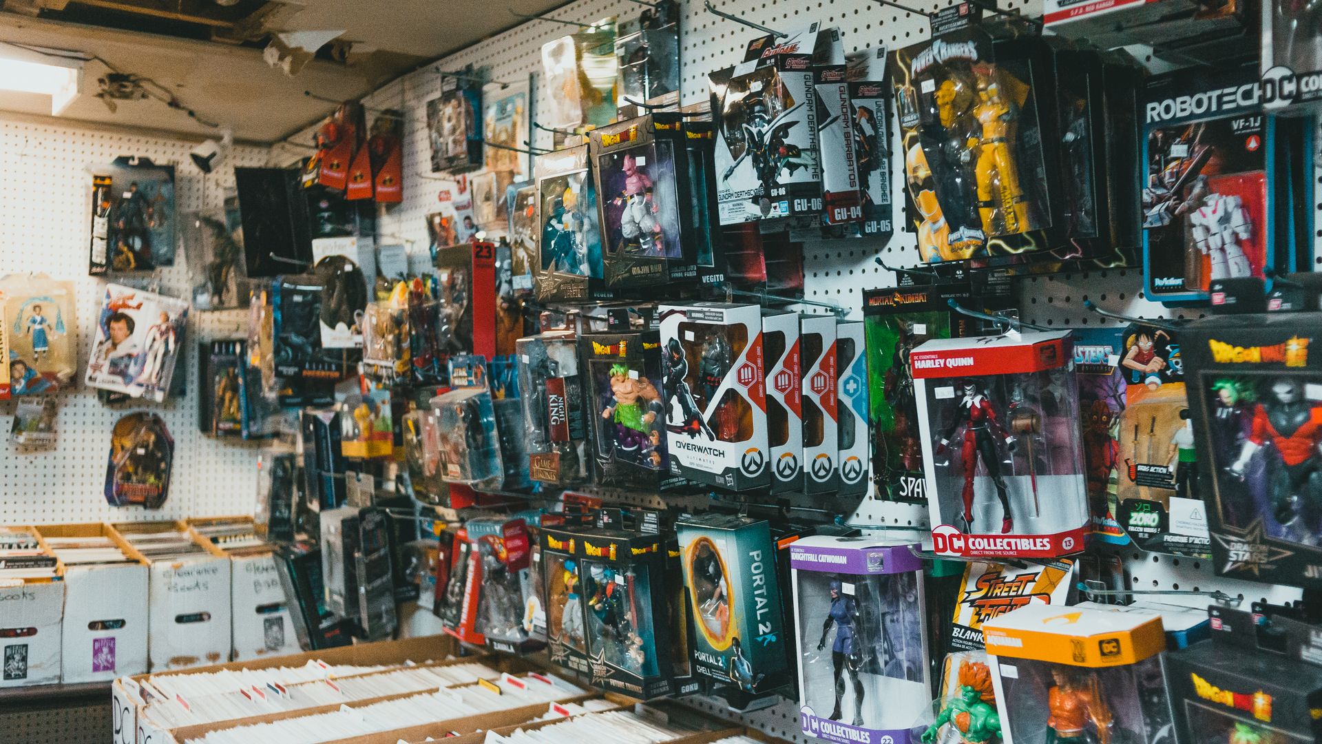Shelves of boxed toys and collectible figures in a retail store