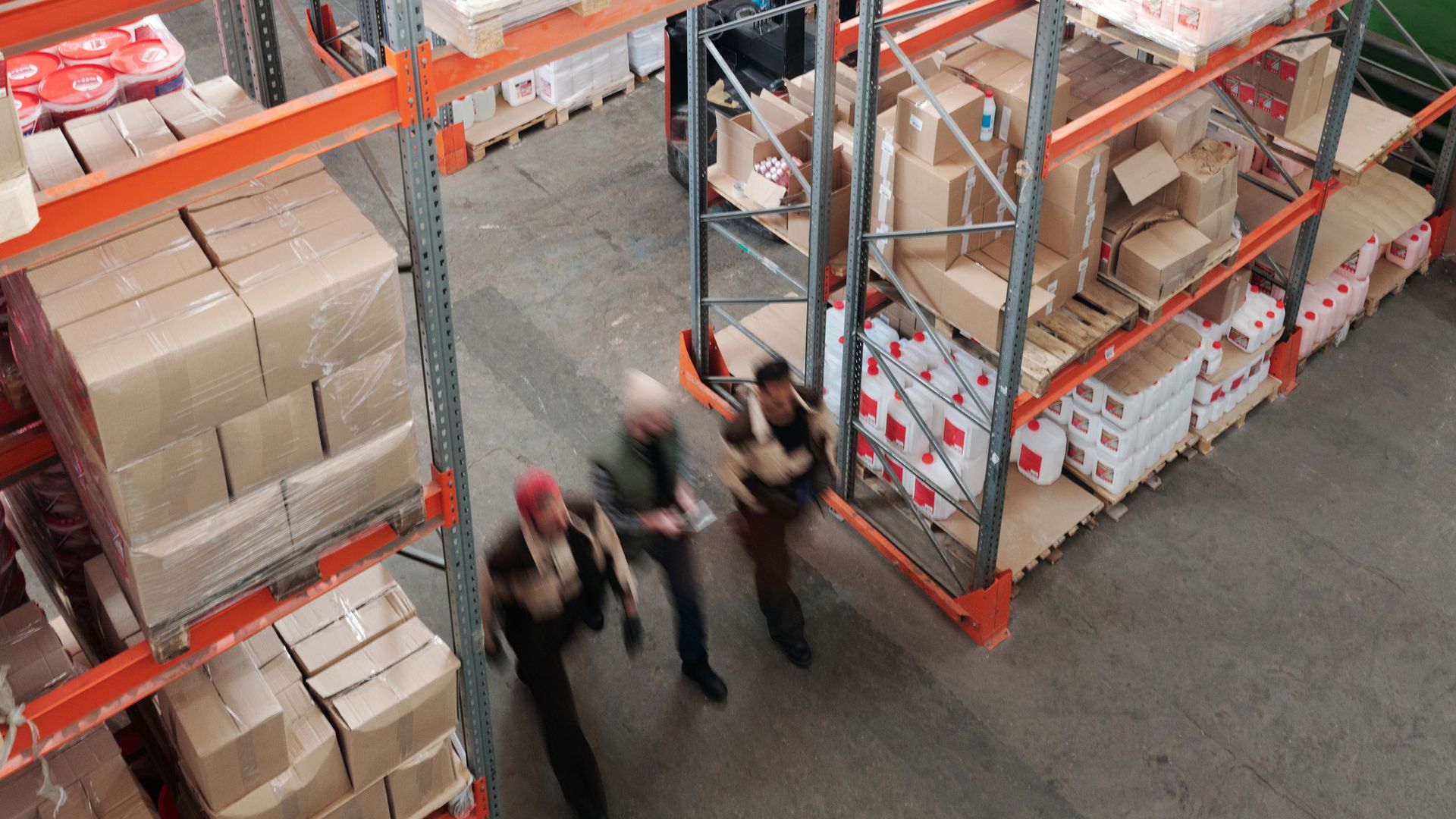 Warehouse team moving orders through a fulfillment center before the daily ship-by cutoff