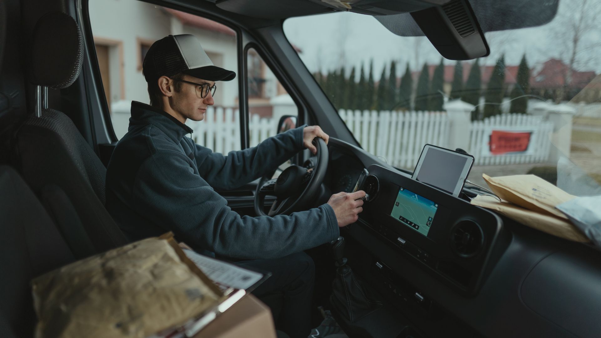 Delivery driver routing parcels, illustrating how estimated delivery dates are calculated for ecommerce orders