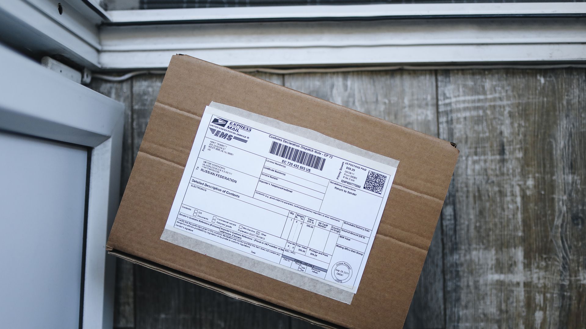 Cardboard shipping box with a printed address label, illustrating address validation and return to sender